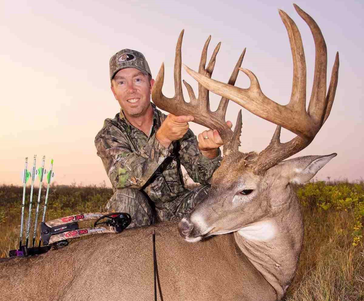 Cody Robbins Holding His 200 Inch Buck He Hunted