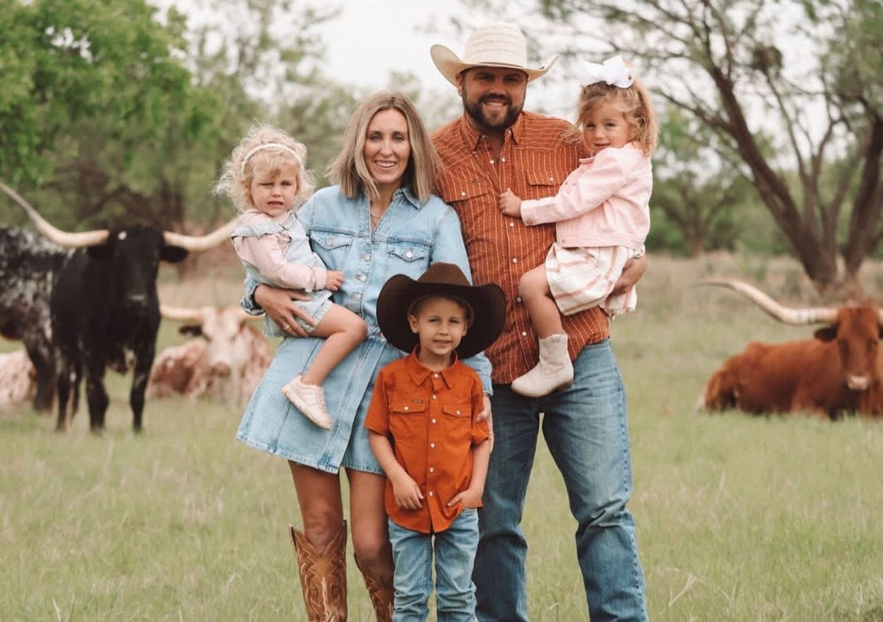 Tanner Evans and Family from Frontier Longhorns in Field with Longhorn Cattle