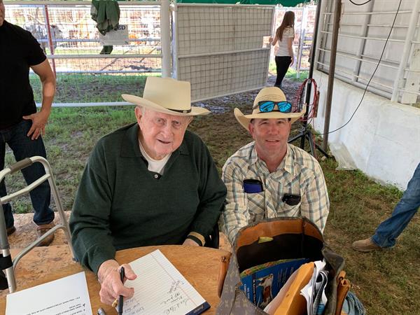 Red McCombs and ranch hand Chad